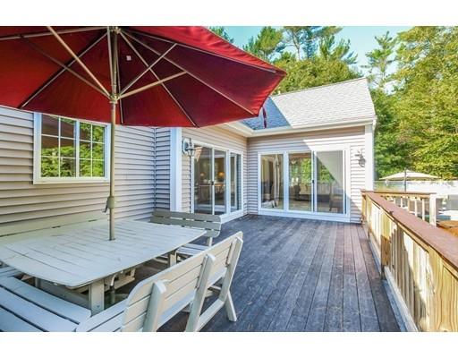 12 Benson Road Rochester, MA 02770 - Photo 25 of 28 a view of house with wooden deck and furniture