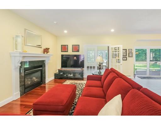 12 Benson Road Rochester, MA 02770 - Photo 3 of 28 a living room with furniture a flat screen tv and a fireplace