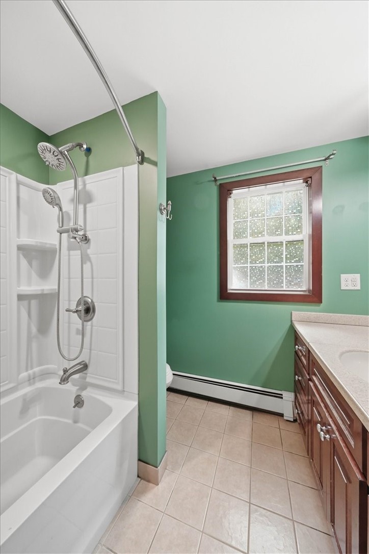 214 Anan Wade Road Glocester, RI 02857 - Photo 24 of 50 The tub/shower combination offers versatility for both quick showers and relaxing baths, while the upgraded shower fixture includes multiple spray options for a more customized experience. Tile flooring completes the practical layout.