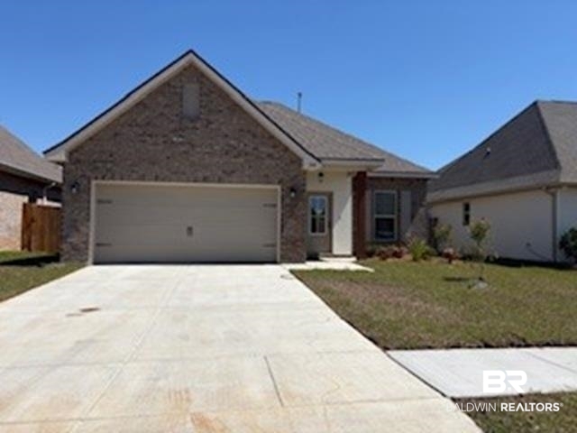 1368 Aldon Street Foley, AL 36535 - Photo 1 of 3 Ranch-style home featuring a front lawn, a garage, and concrete driveway