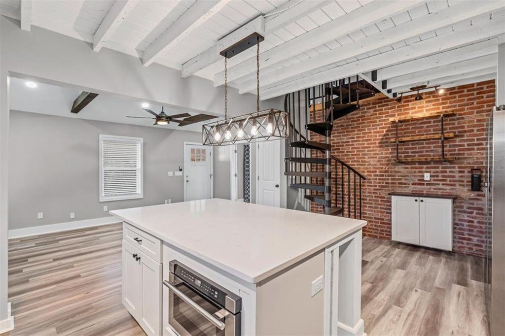 18 Farmer Road Northwest Cartersville, GA 30120 - Photo 12 of 33 a kitchen that has a microwave a sink and a stove
