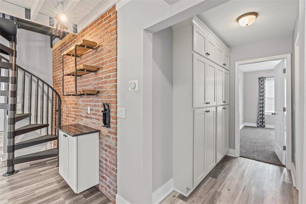 18 Farmer Road Northwest Cartersville, GA 30120 - Photo 14 of 33 a view of a hallway with wooden floor and staircase