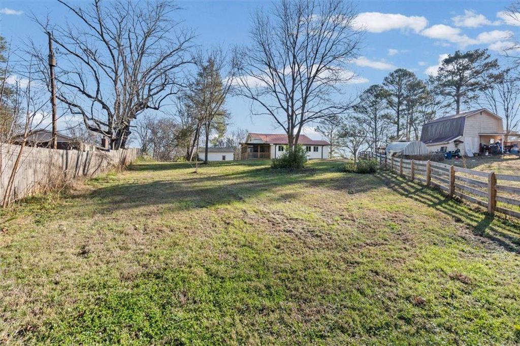 18 Farmer Road Northwest Cartersville, GA 30120 - Photo 26 of 33 a view of a yard with a house and a large tree