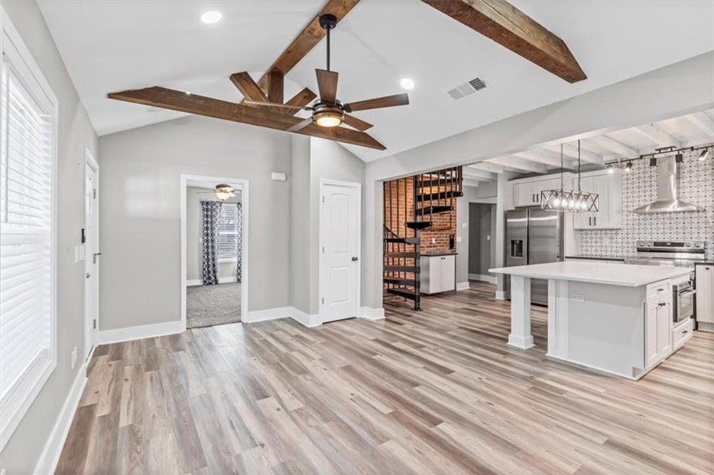18 Farmer Road Northwest Cartersville, GA 30120 - Photo 9 of 33 a view of a kitchen with furniture and wooden floor