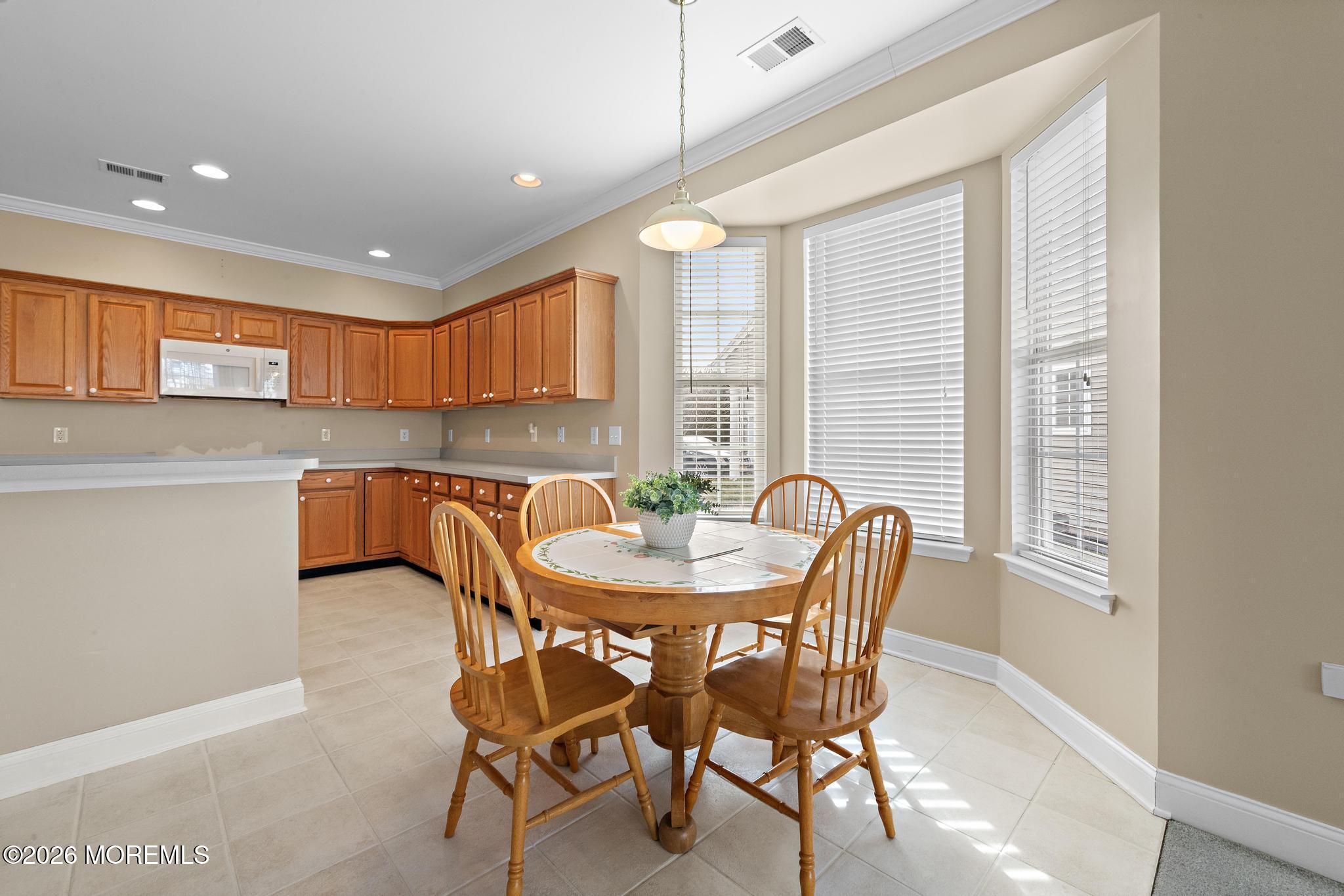 407 Golf View Drive Little Egg Harbor, NJ 08087 - Photo 13 of 58 a view of a dining room that has a table and chairs in it