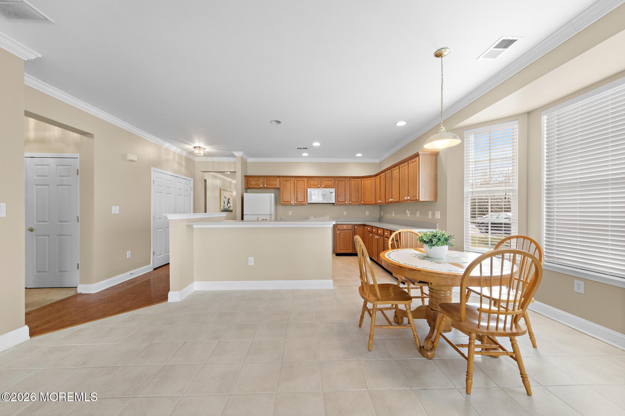 407 Golf View Drive Little Egg Harbor, NJ 08087 - Photo 16 of 58 a view of a dining room with furniture window and outside view