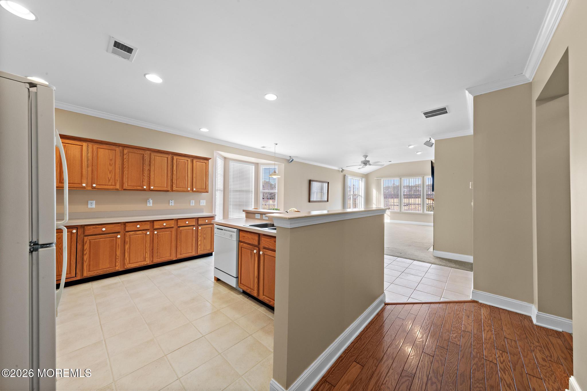 407 Golf View Drive Little Egg Harbor, NJ 08087 - Photo 24 of 58 a kitchen with granite countertop a refrigerator and a stove top oven