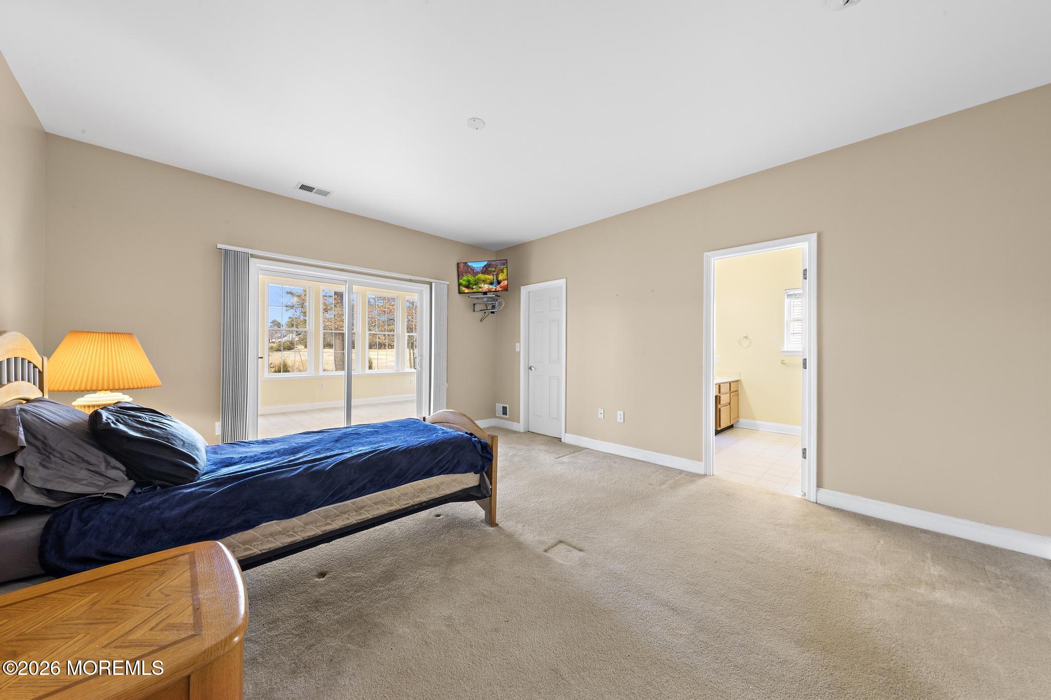 407 Golf View Drive Little Egg Harbor, NJ 08087 - Photo 31 of 58 a bedroom with a bed and a window
