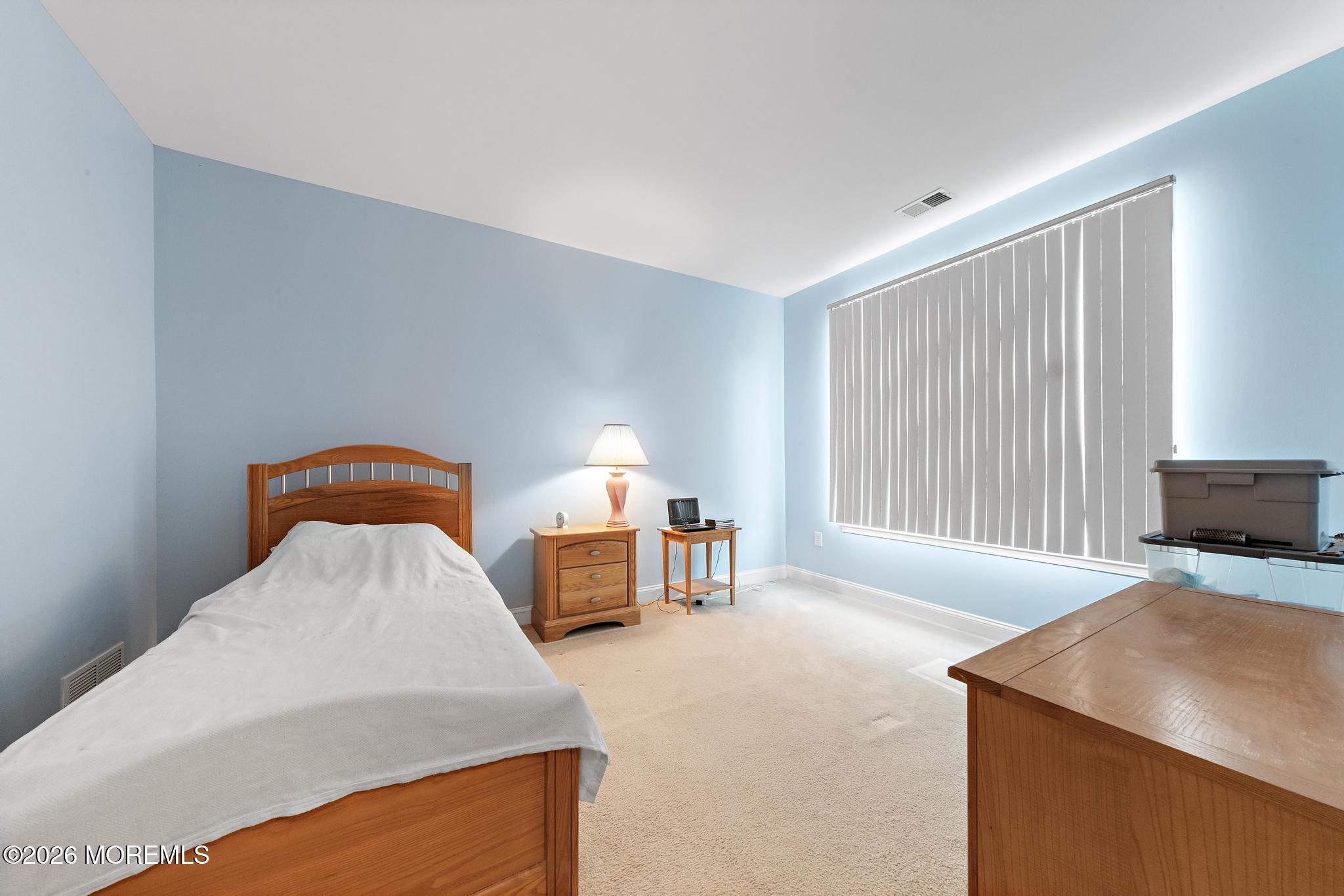 407 Golf View Drive Little Egg Harbor, NJ 08087 - Photo 34 of 58 a bedroom with a bed and a flat screen tv