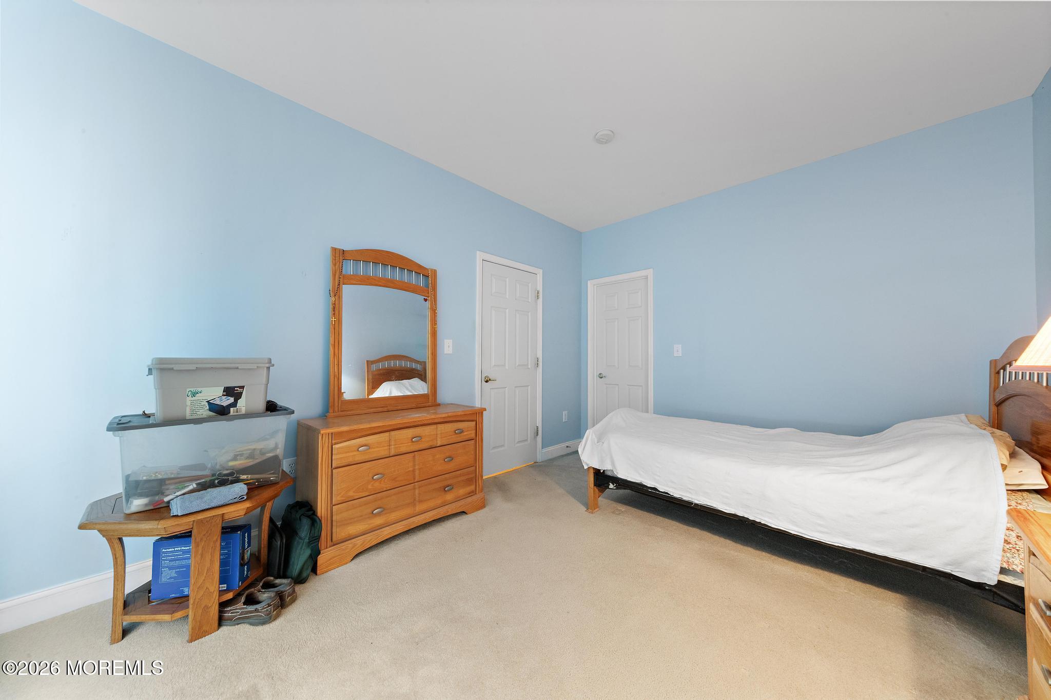 407 Golf View Drive Little Egg Harbor, NJ 08087 - Photo 35 of 58 a bedroom with a bed and a dresser
