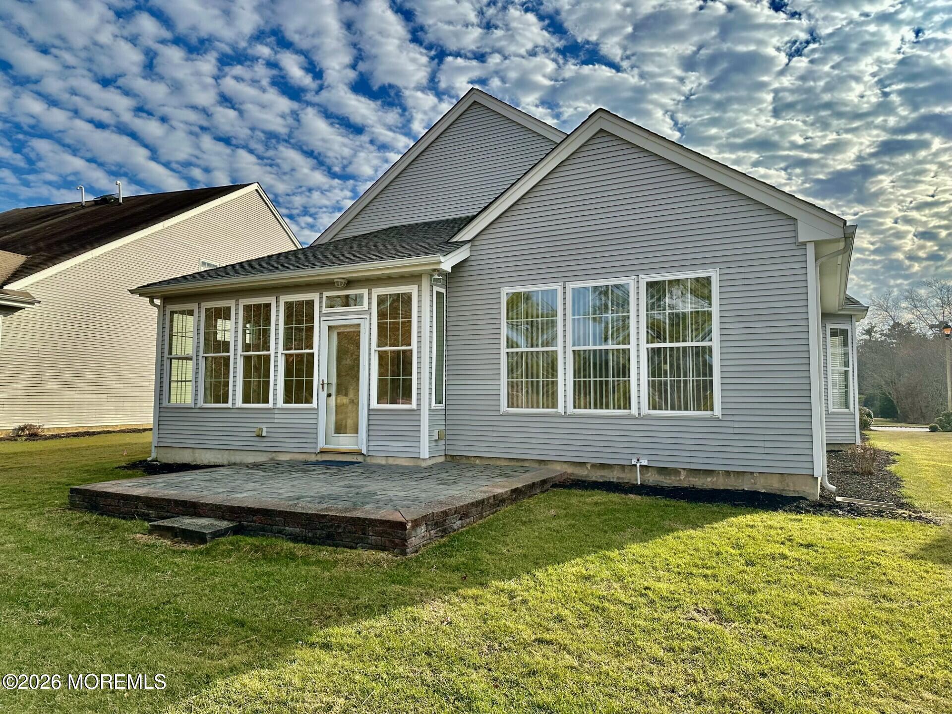407 Golf View Drive Little Egg Harbor, NJ 08087 - Photo 4 of 58 a front view of a house with a yard