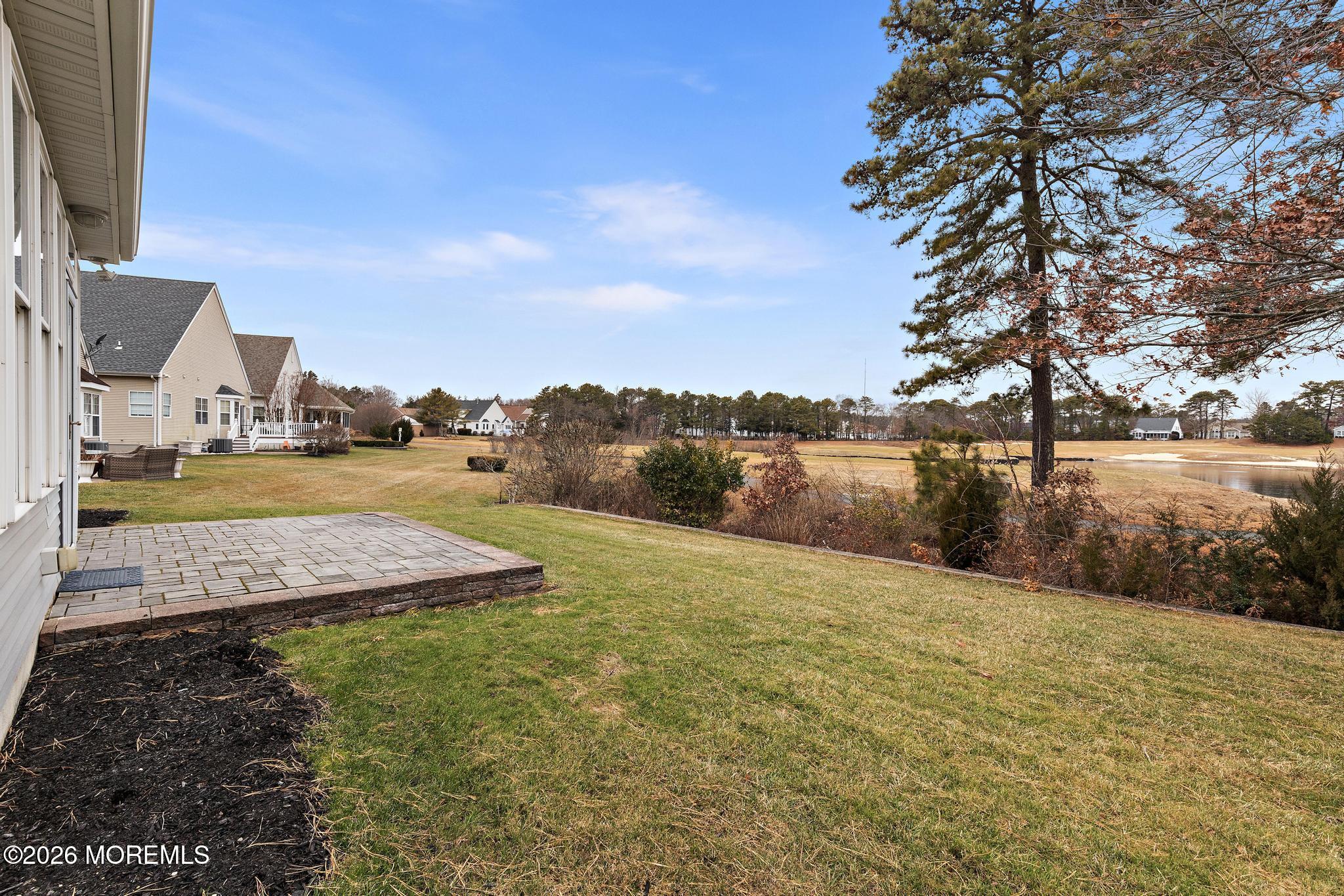 407 Golf View Drive Little Egg Harbor, NJ 08087 - Photo 50 of 58 a view of a lake with houses in the back