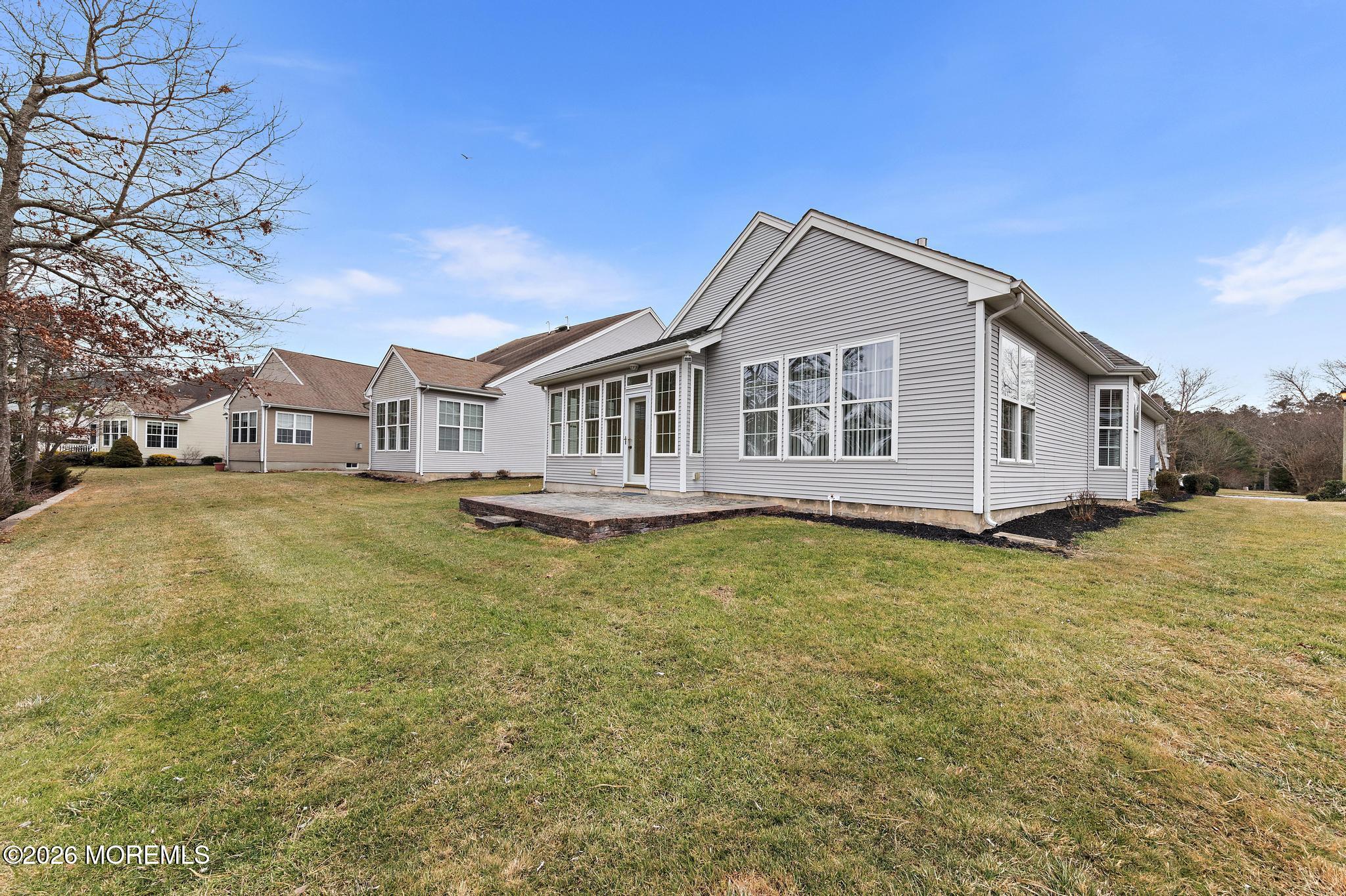 407 Golf View Drive Little Egg Harbor, NJ 08087 - Photo 54 of 58 a front view of a house with a garden and deck