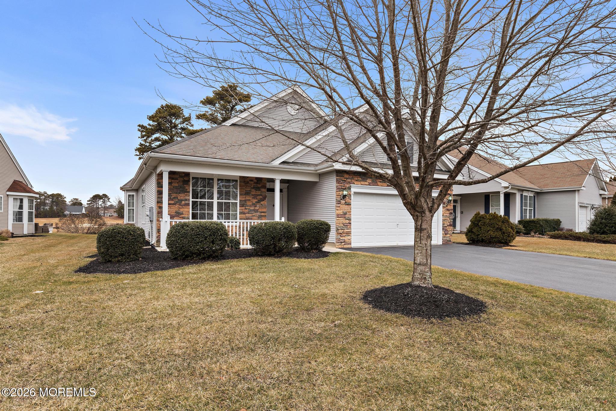 407 Golf View Drive Little Egg Harbor, NJ 08087 - Photo 6 of 58 a front view of a house with a yard