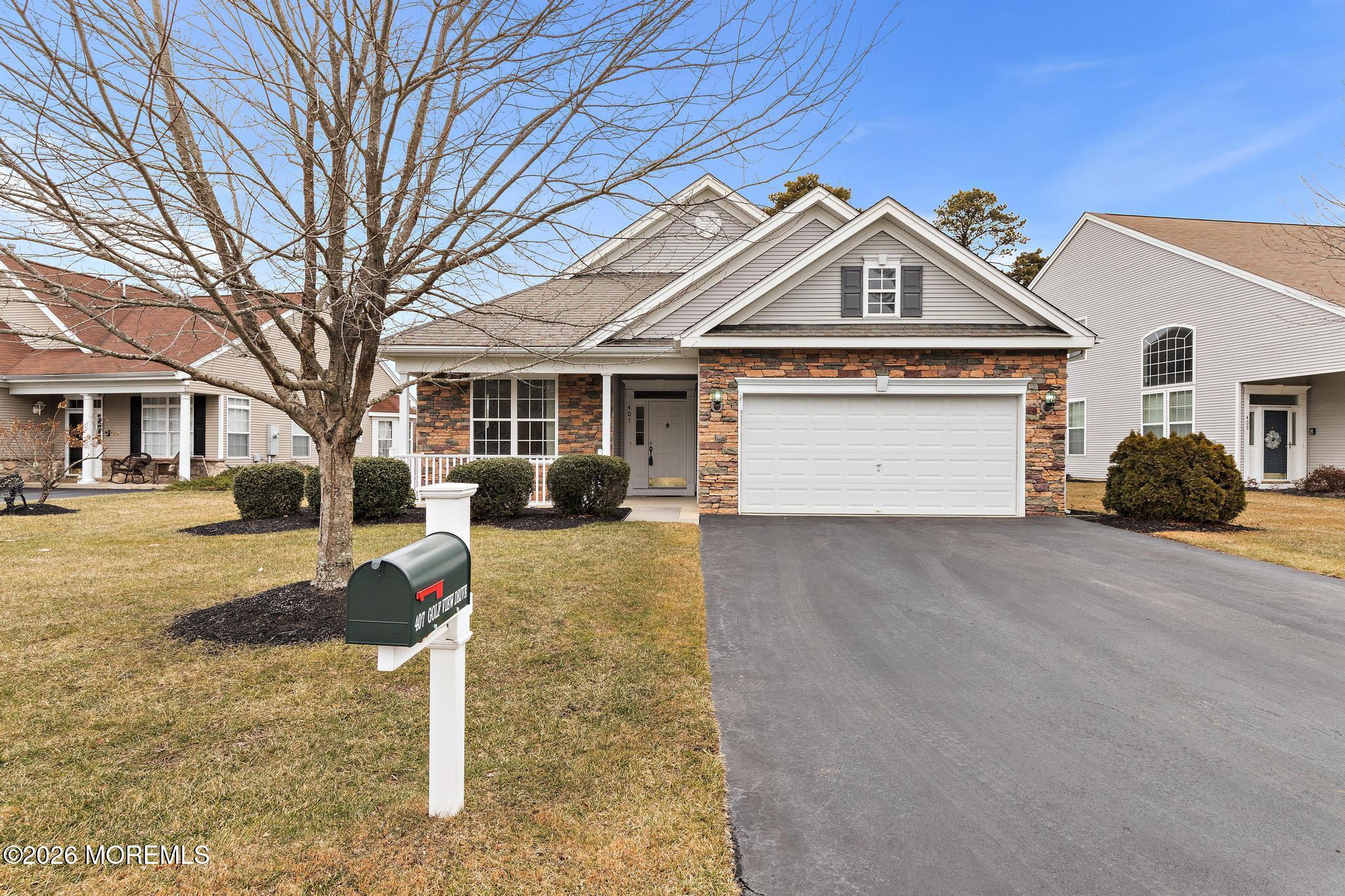 407 Golf View Drive Little Egg Harbor, NJ 08087 - Photo 7 of 58 a front view of a house with a yard