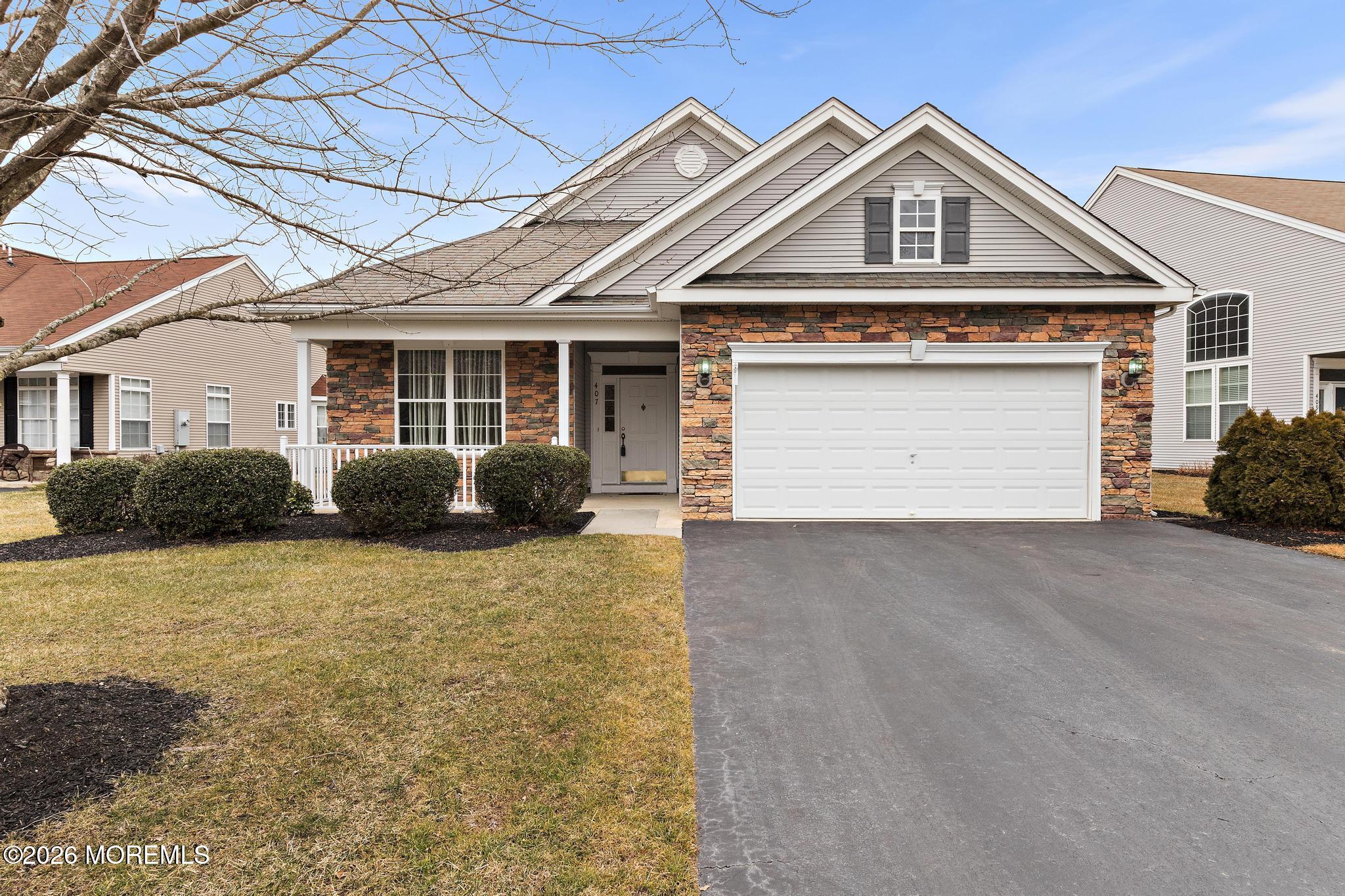 407 Golf View Drive Little Egg Harbor, NJ 08087 - Photo 8 of 58 a front view of a house with a yard and garage