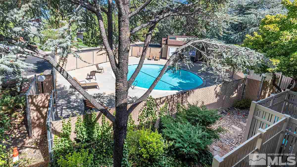 4544 Matich Drive Reno, NV 89502 - Photo 12 of 19 a backyard of a house with lots of trees