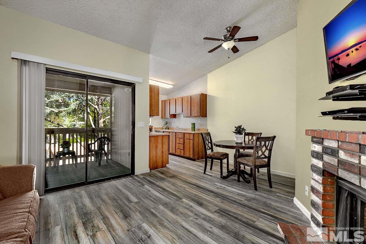 4544 Matich Drive Reno, NV 89502 - Photo 4 of 19 a view of a dining room with furniture window and wooden floor