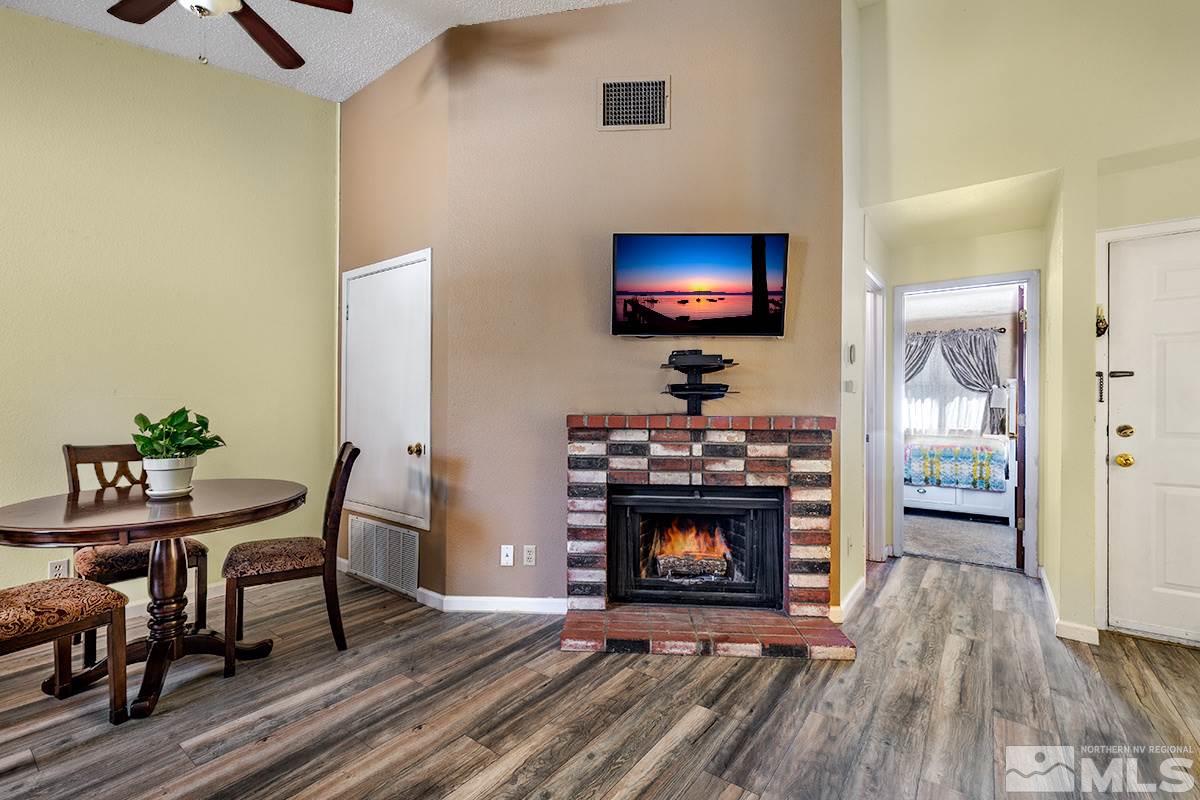 4544 Matich Drive Reno, NV 89502 - Photo 5 of 19 a living room with furniture a flat screen tv and a fireplace
