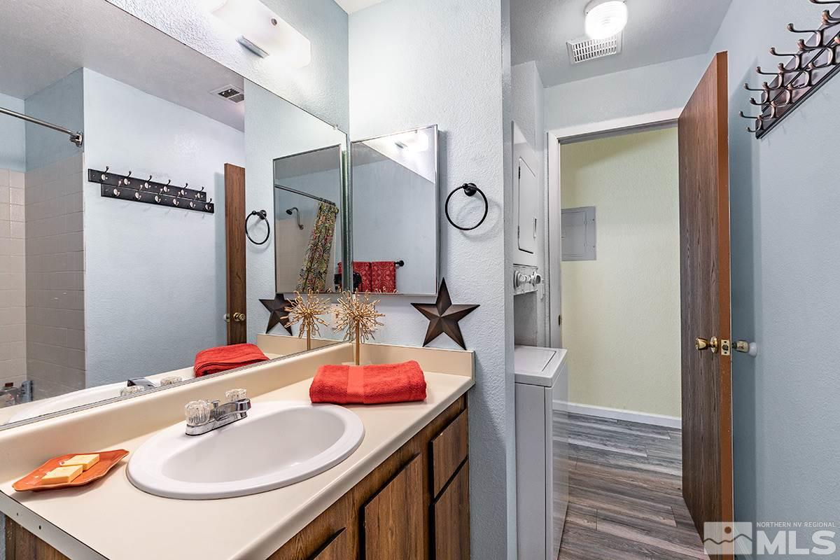 4544 Matich Drive Reno, NV 89502 - Photo 9 of 19 a bathroom with a sink vanity and a mirror
