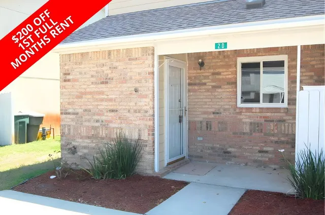 a view of a brick wall with a large window