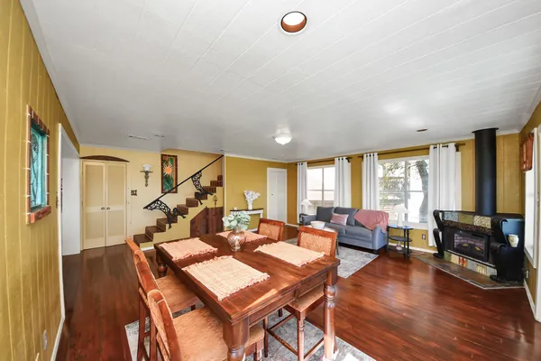 a bed room with a bed and a chair