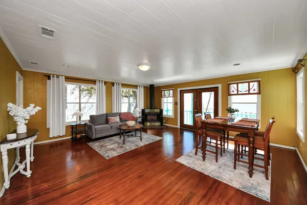 a bathroom with a sink a toilet a mirror and shower