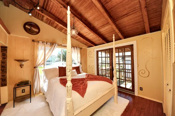 a view of living room with furniture and wooden floor