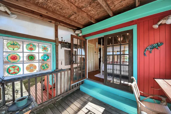 a bedroom with furniture and a window