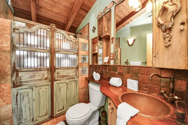 a spacious bedroom with a large bed and a large window