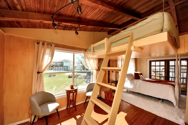 a bedroom with a bed and a couch