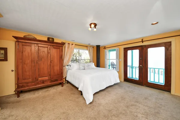 a view of a balcony with chairs