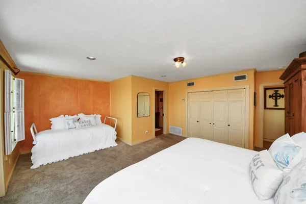 a kitchen that has a table and chairs in it