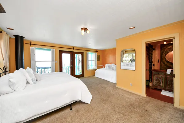 a kitchen with granite countertop a sink stove and cabinets