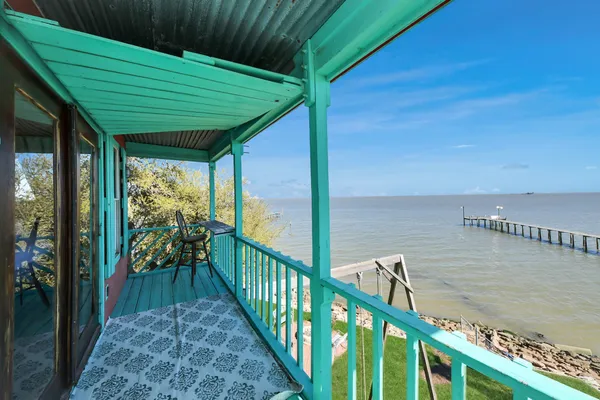 a kitchen with a stove a sink and a microwave