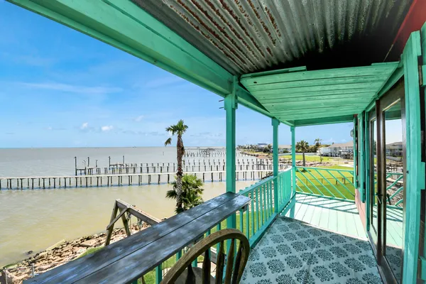 a bathroom with a toilet a sink and a mirror
