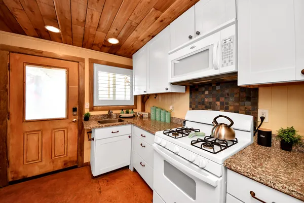 a view of swimming pool with a table and chairs