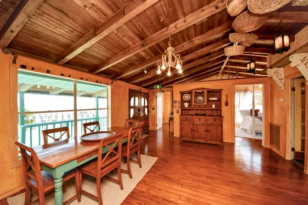 a view of a livingroom with furniture wooden floor and window