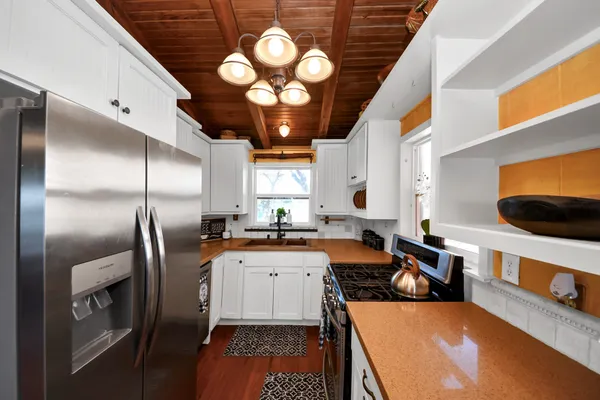 a living room with lots of furniture and a large window