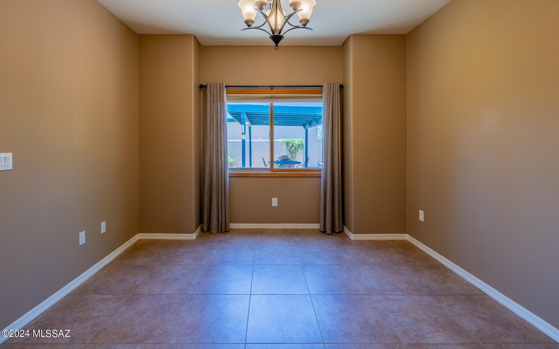 341 Sharon Road Vail, AZ 85641 - Photo 16 of 50 an empty room with windows and entrance