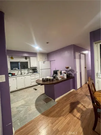a kitchen with kitchen island granite countertop lots of counter top space and appliances