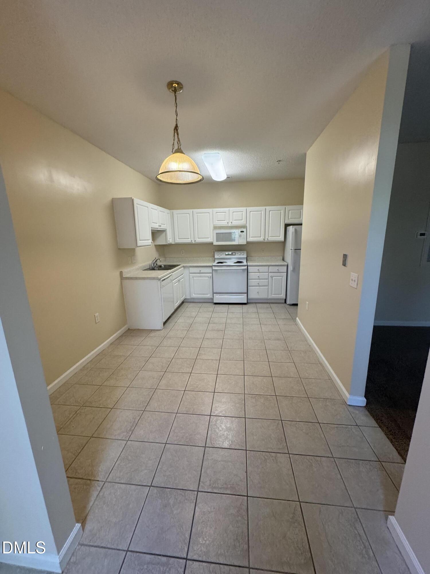 2520 Friedland Place, Unit 201 Raleigh, NC 27617 - Photo 6 of 17 KITCHEN-DINING ENTRY