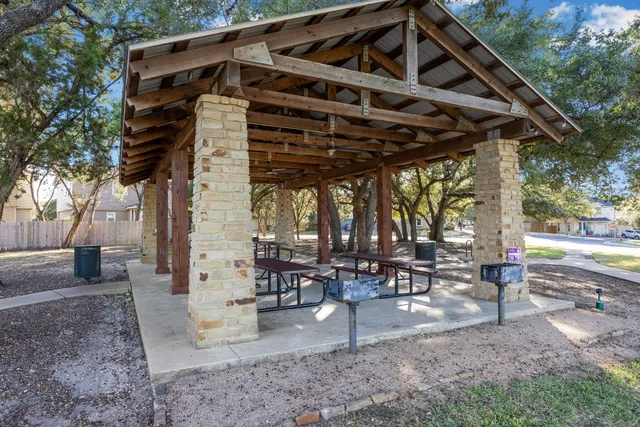 a view of a chairs and table in the patio