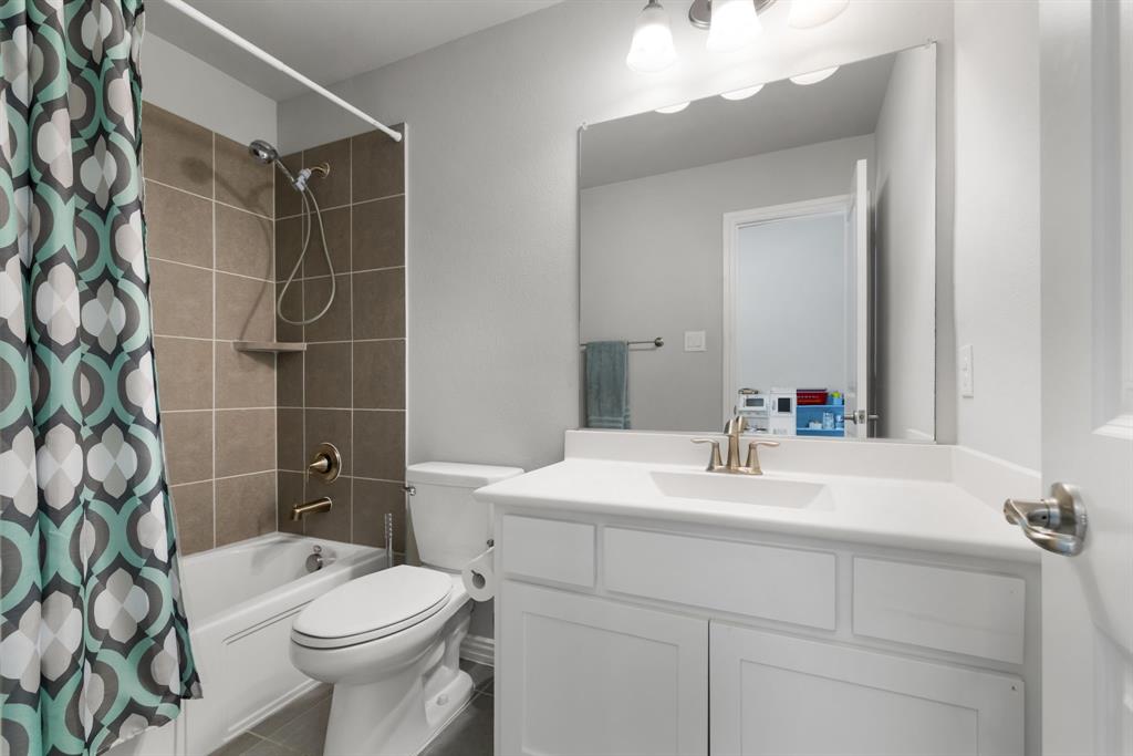 6309 Hall Road Frisco, TX 75034 - Photo 27 of 35 Full bath with shower / tub combo with curtain and vanity