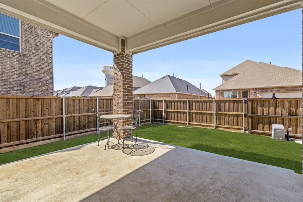 6309 Hall Road Frisco, TX 75034 - Photo 29 of 35 Fenced backyard with a patio area