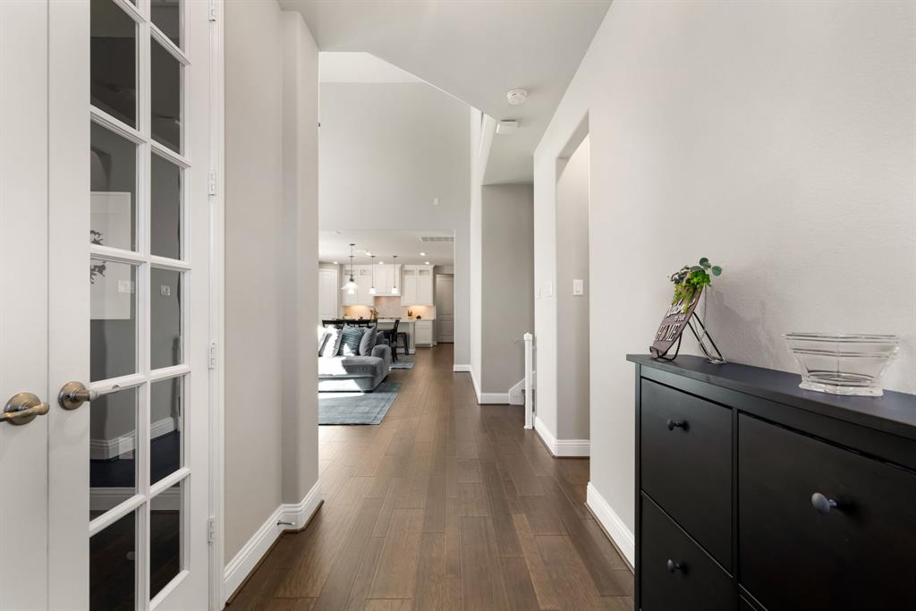 6309 Hall Road Frisco, TX 75034 - Photo 4 of 35 Hall with dark wood-style floors and baseboards