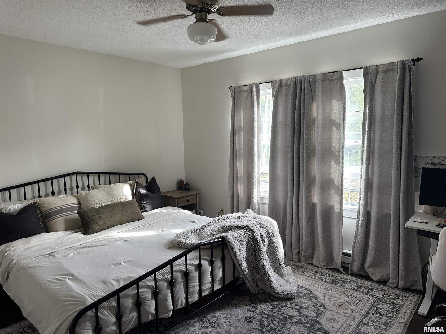 1307 Charles Street Carterville, IL 62918 - Photo 13 of 21 a bedroom with a bed and a chandelier