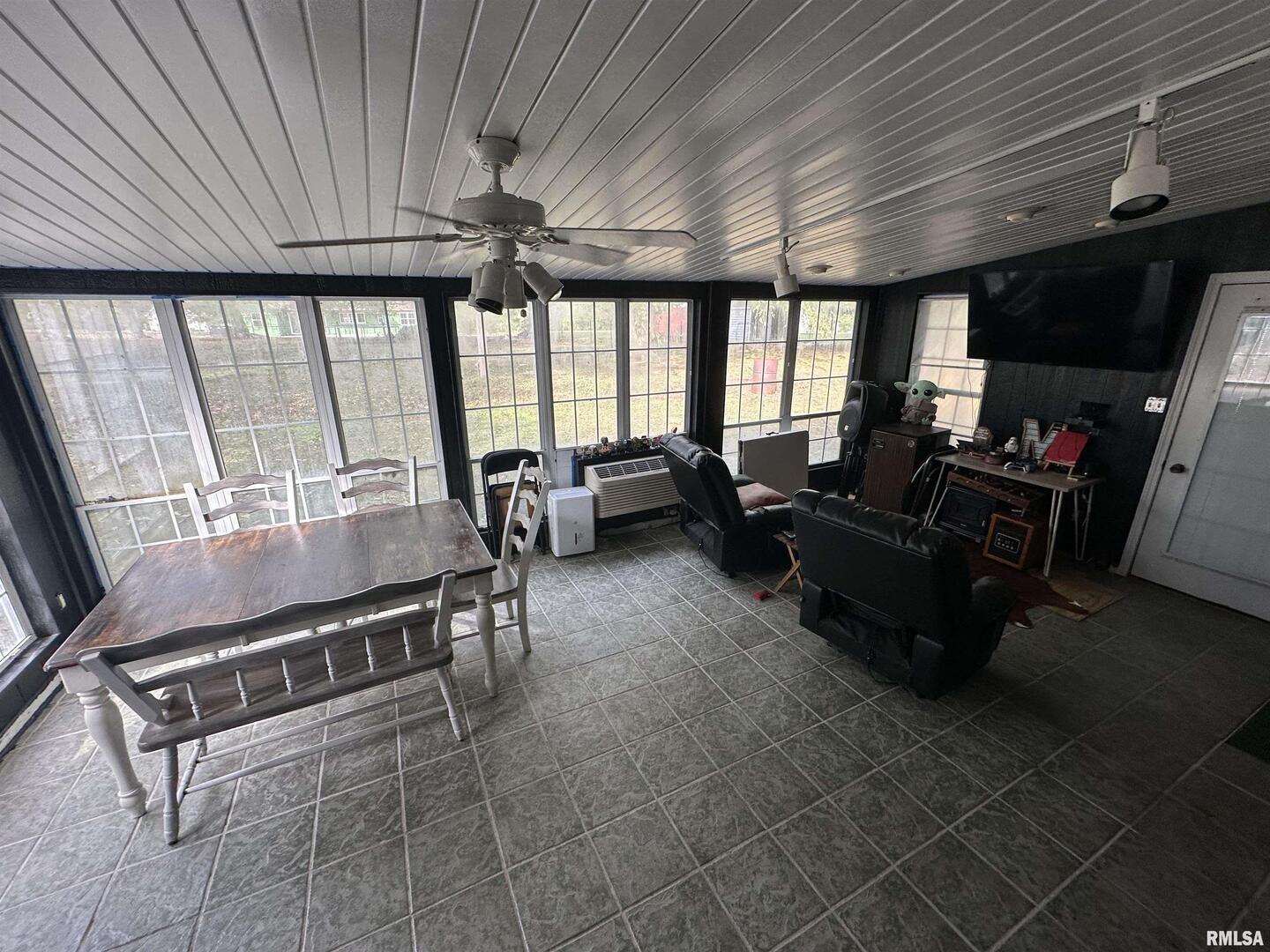1307 Charles Street Carterville, IL 62918 - Photo 20 of 21 a living room with furniture a flat screen tv and large windows
