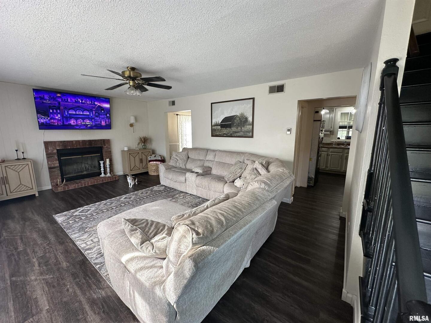 1307 Charles Street Carterville, IL 62918 - Photo 3 of 21 a living room with furniture and a flat screen tv