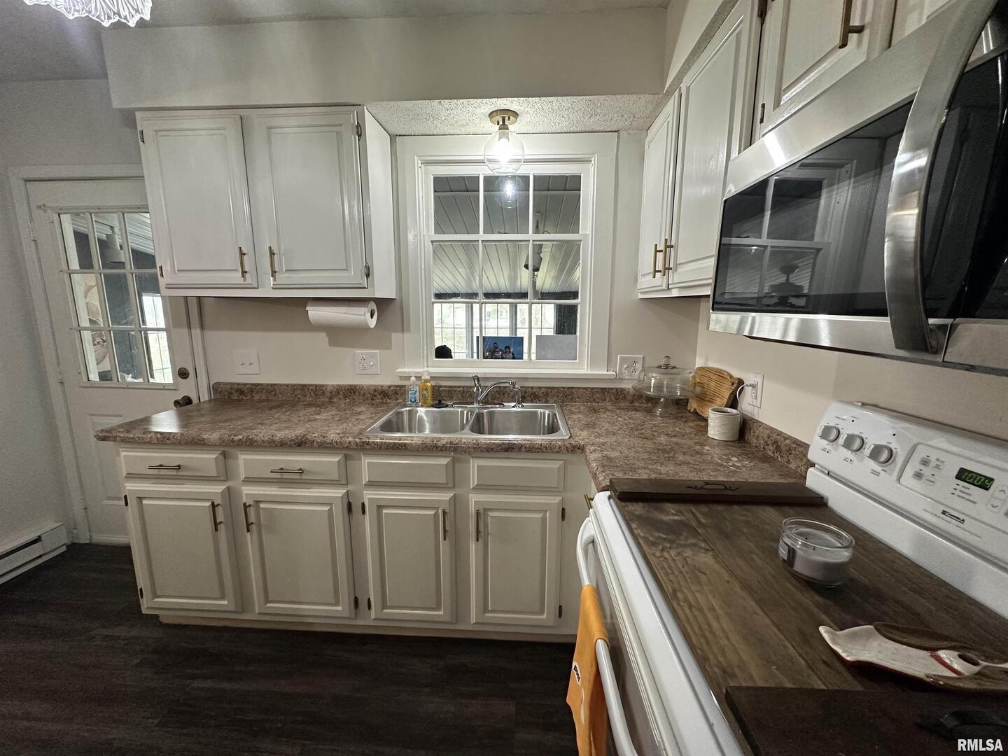 1307 Charles Street Carterville, IL 62918 - Photo 8 of 21 a kitchen with a stove and a sink